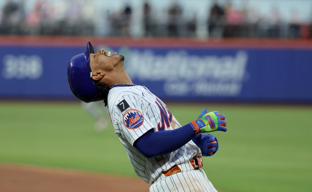Francisco Lindor #12 of the New York Mets reacts after hitting into a double play.