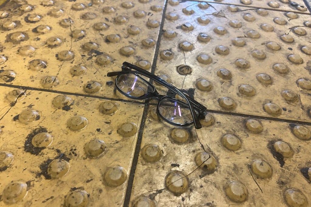 MTA workers retrieved a pair of glasses from the tracks at Union Square.