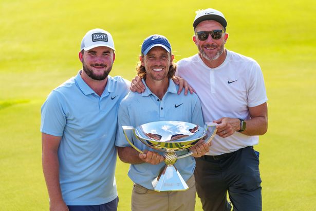 Tommy Fleetwood celebrated with his step-son, left, and his caddie Ian Finnis after the Tour Championship victory