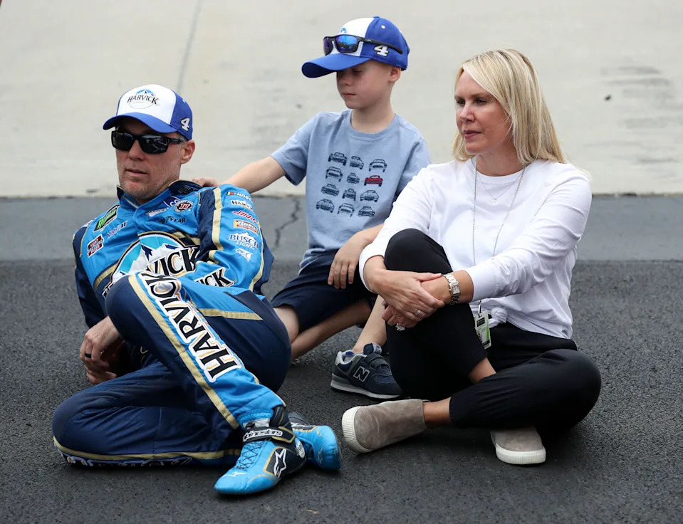 NASCAR Cup Series driver Kevin Harvick (left) sits on pit road with his wife DeLana Harvick and their son Keelan Harvick