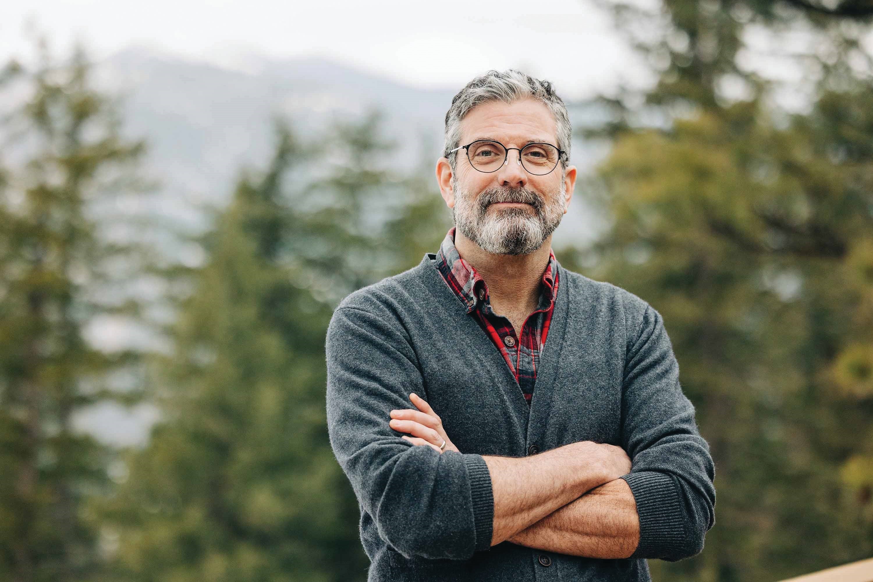 The author's headshot is outdoorsy and sweatery.