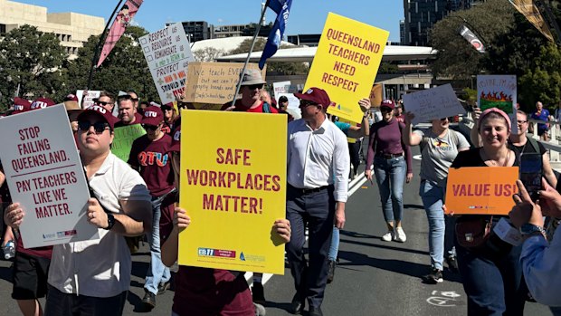 Teachers march over the Victoria Bridge on Wednesday.