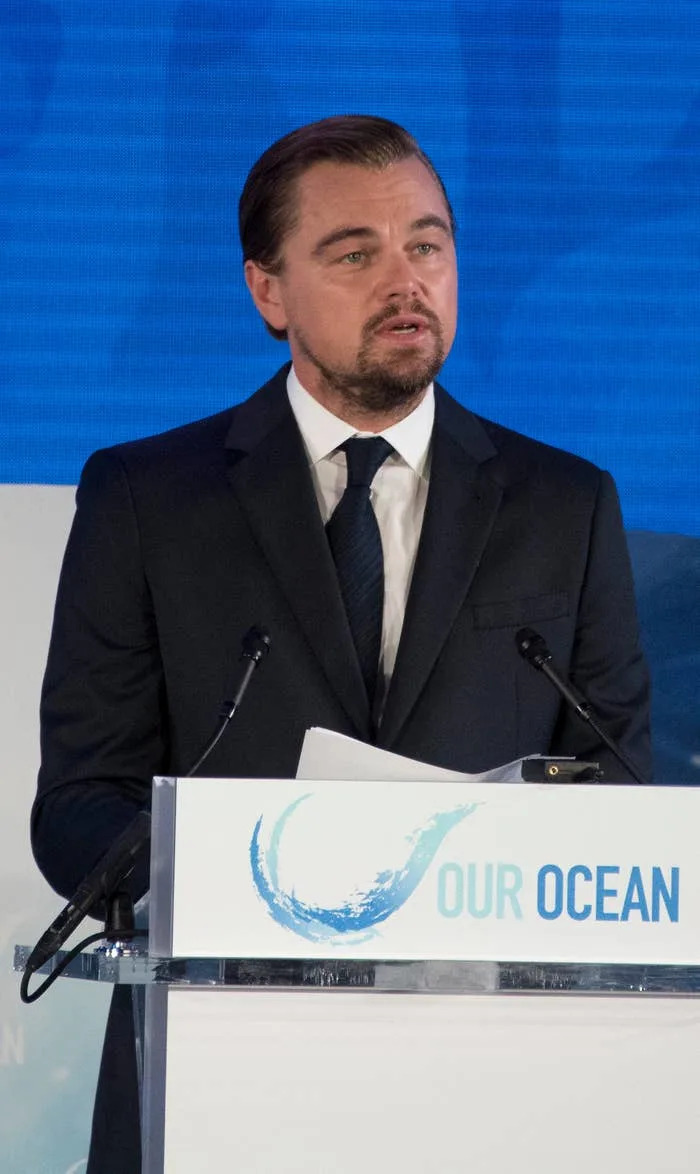 Leo speaking at a podium with an "Our Ocean" logo