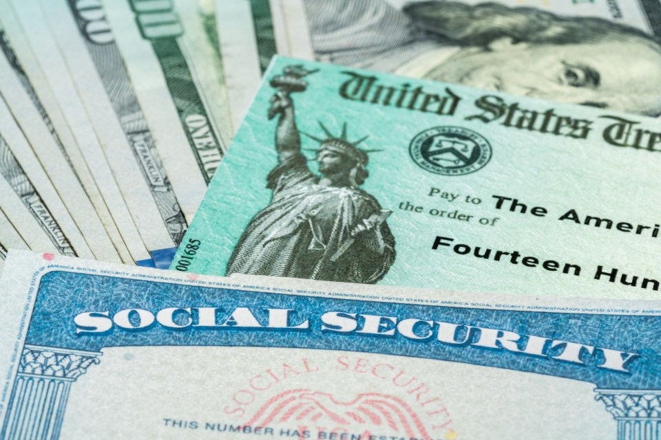 US Treasury check, social security card, and $100 bills.