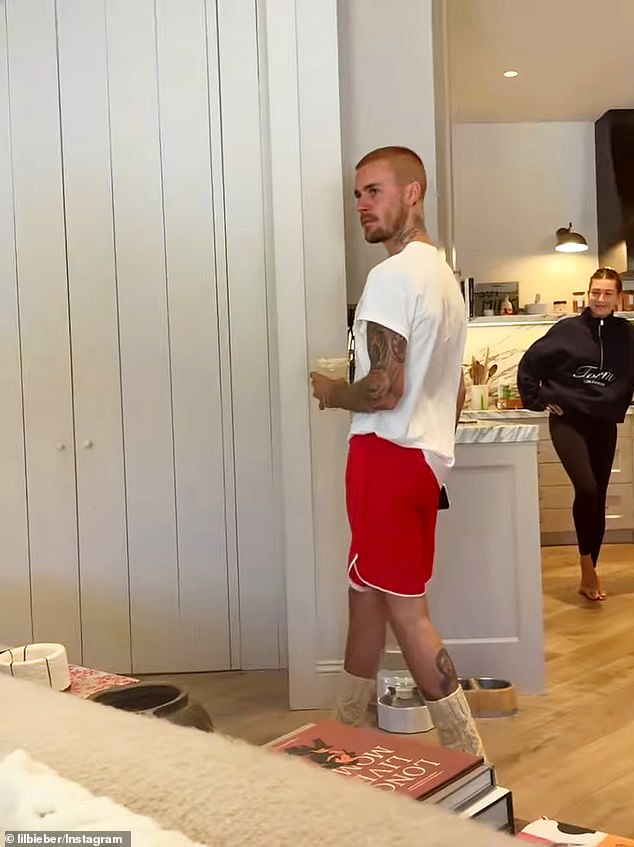 Hailey, 28, made a cameo appearance as she was shown in the background wearing black leggings and a black pullover sweatshirt