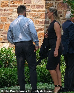 Kylie dressed in a simple knee-length black shift dress as she accompanied her husband