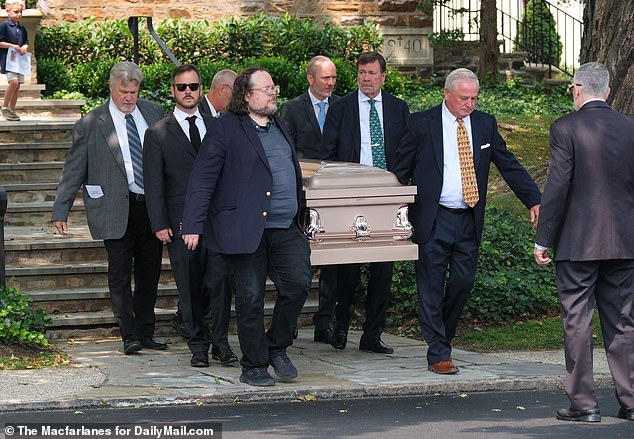 Ed Kelce (back left) and other pallbearers carried her coffin down the steps of the church