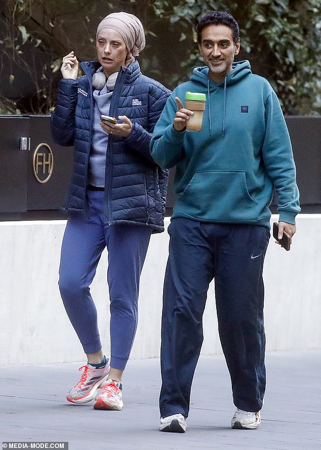 The 47-year-old stepped out for a coffee date with his wife, Susan Carland, 45, (left) in Melbourne on Thursday