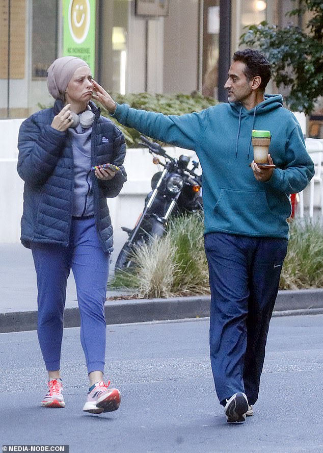 She added loose blue track pants and sneakers, as well as wearing a traditional head covering and headphones
