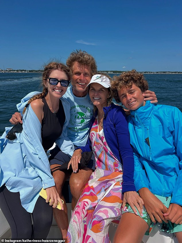 Katherine made one of her few appearances in her photoset in a group photo with her uncle Anthony Anthony Shriver and her mother