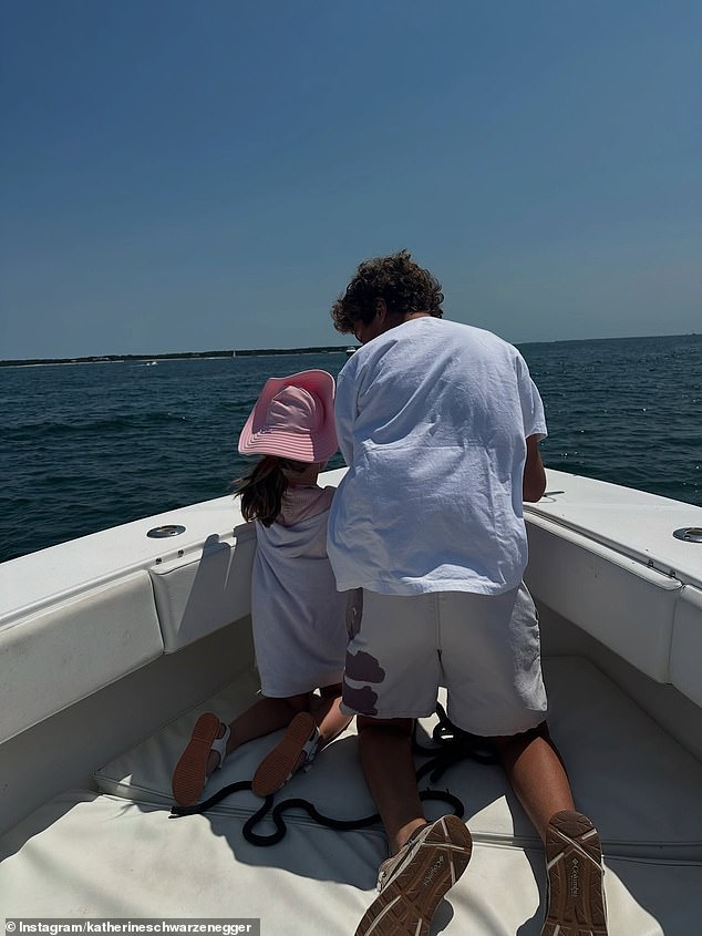 Another of Katherine's extended family members appeared to be having a conversation with Lyla at the bow of the boat in one photo