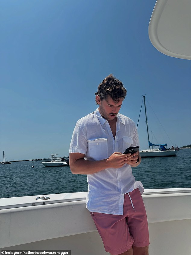 Katherine also snapped a photo of her brother Christopher, 27, who showed off his impressive weight loss in a white linen button-up shirt and faded coral-colored shorts
