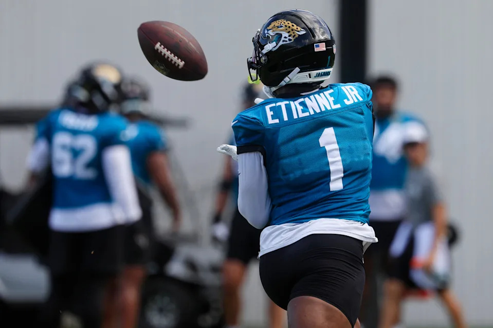 Jacksonville Jaguars running back Travis Etienne Jr. (1) hauls in a reception during an NFL training camp session at the Miller Electric Center, Friday, July 25, 2025, in Jacksonville, Fla. [Corey Perrine/Florida Times-Union]