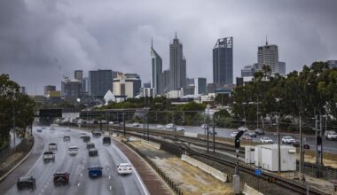 Perth shivers through coldest day in 50 years as residents marvel at rain, hail