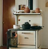 A true family heirloom, the heritage stove continues to warm the home and produce meals as it has for decades. On its ledge, Rael displays grinding stones, 3D-printed clay vessels, and cast-aluminum bricks. He is known around the valley for converting thousands of used cans into the latter. Neighbors have taken to sending their used soda and beer containers his way, curious to see how they will eventually transform into sculptures and other functional pieces.