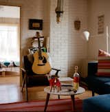 Rael balances a heavy workload with quiet moments of unwind curled up in the living room, fiddling on the acoustic guitar, testing spirits like Bacanora or Sotol toted back from Mexico by a friend, or crafting a string of puns with his son, Mattias.