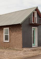 On Father’s Day of 2022, Rael and Mattias—whose birthday happens to be just one day apart from Rael’s—restored the primary home’s outer layer to its original state by removing concrete and applying a mud plaster. From a young age, Mattias has worked alongside Rael building hornos, or earth ovens, collaborating on larger 3D-printed buildings, and even driving the tractor.