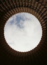 Each of the three massive adobe volumes that Rael printed on his property in 2020 open to the sky and, with no foundation, connect directly to the earth. Titled Casa Covida, the project combined new approaches with ancient, Indigenous traditions to reimagine cohabitation and connection in the midst of a global pandemic.