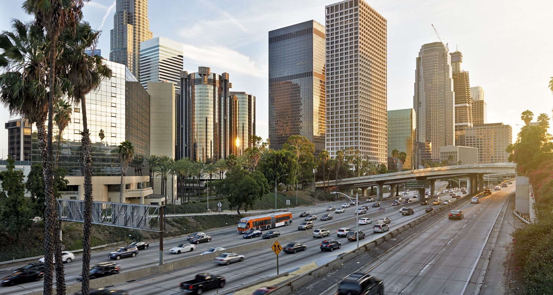 Downtown Los Angeles in the early evening with commute traffic in stock photo.