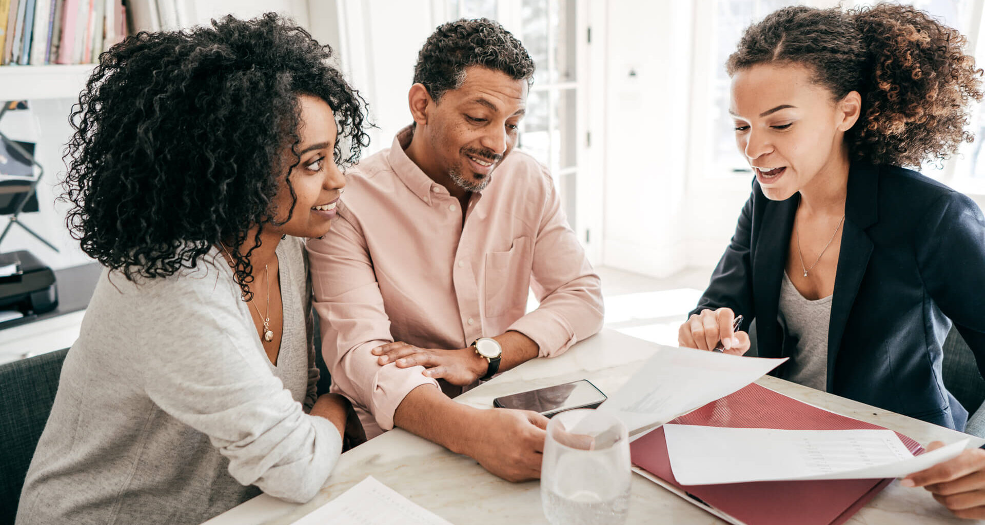 A couple speaking to their lawyer.
