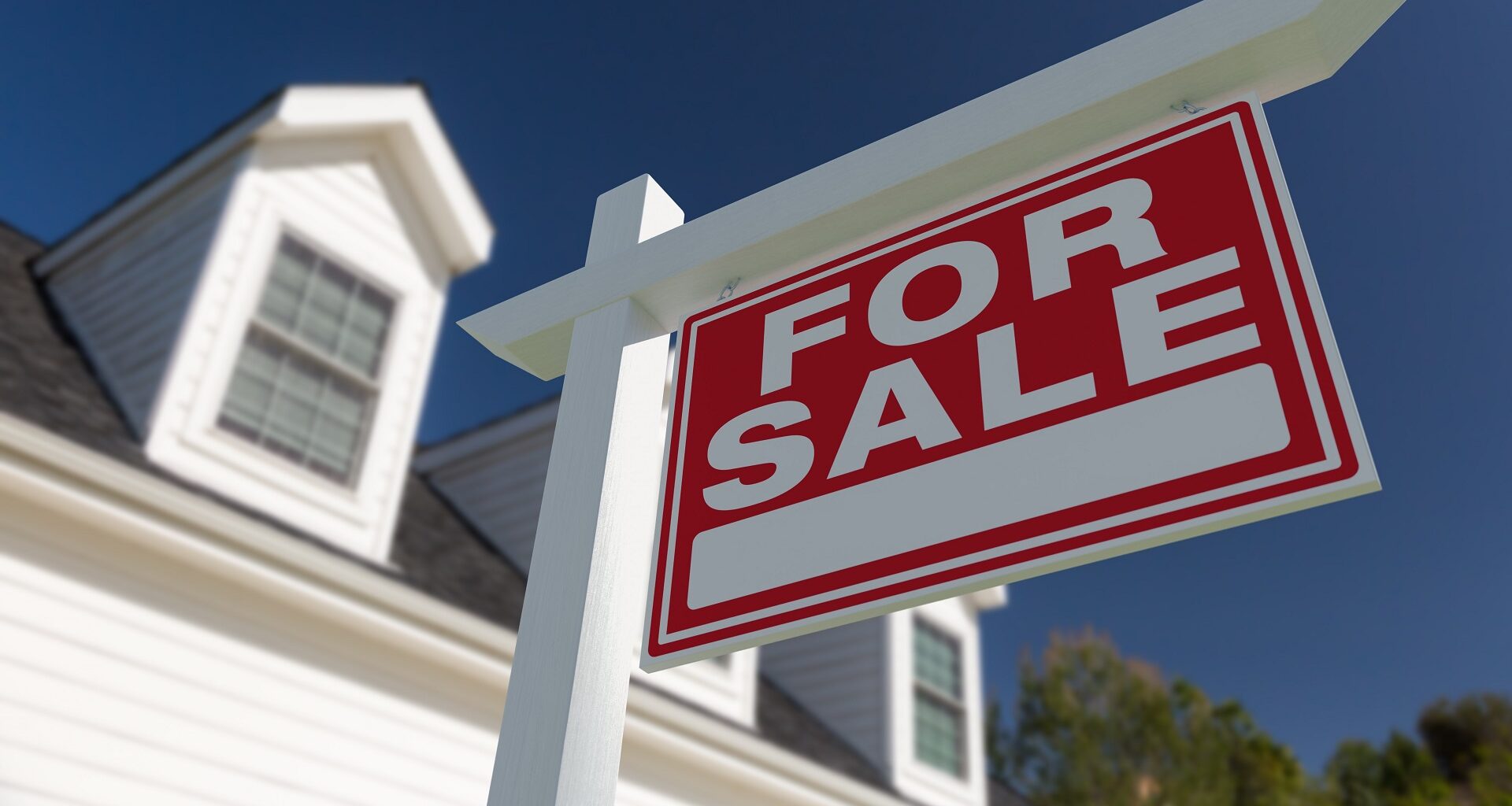 For Sale Real Estate Sign in Front of New House. stock photo
