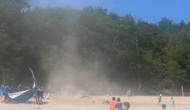 Watch: Children on New York beach run screaming from dust devil