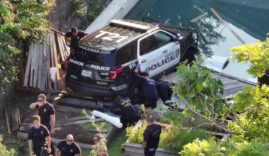 Houston police SUV crashes through fence, dangles in family’s pool in The Heights