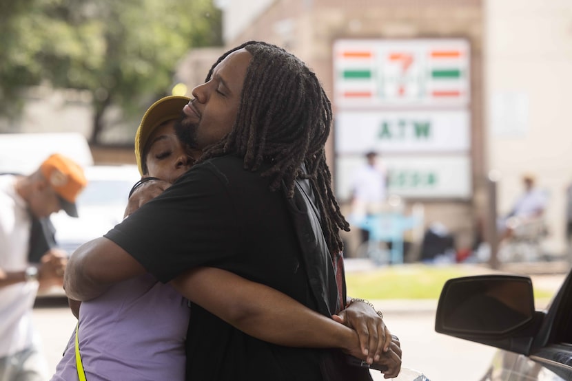 Alex Nelson, affectionately known as Uncle JoJo, hugs Lelani Russell during his 8th Annual...
