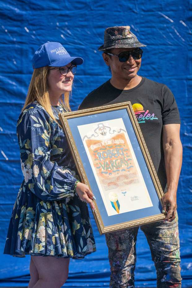 Supervisor Lindsey Horvath and Artist Robert Vargas pose with an...