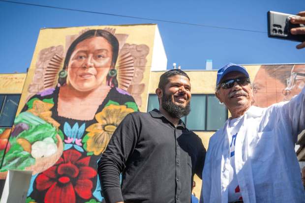 Activist Edward James Olmos takes a selfie with Francisco Perez,...
