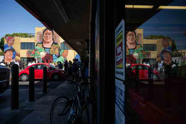 Artist Robert Vargas’ “Nourishing the Community” mural depicting a goddess...