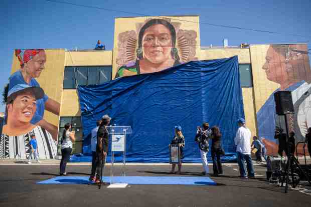 Artist Robert Vargas’ “Nourishing the Community” mural depicting a goddess...