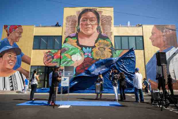 Artist Robert Vargas’ “Nourishing the Community” mural depicting a goddess...