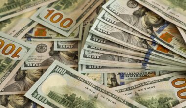 Stacks of 100 US dollar bills scattered closely together. Concept of wealth, financial success, banking, investment, income, and economic prosperity. stock photo