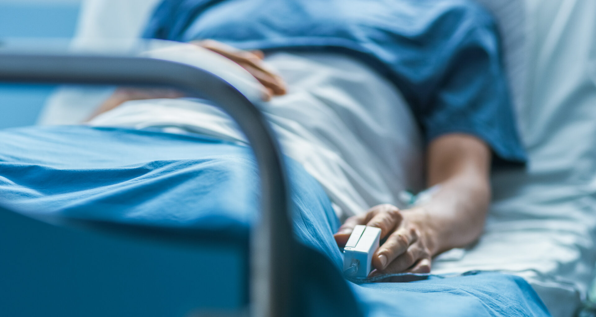 In the Hospital Sick Male Patient Sleeps on the Bed.