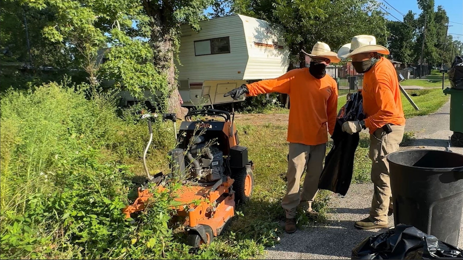 Father and son transforming lawns, uplifting community