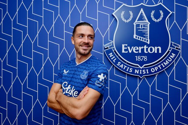 Jack Grealish poses for a photograph after signing for Everton FC at Finch Farm