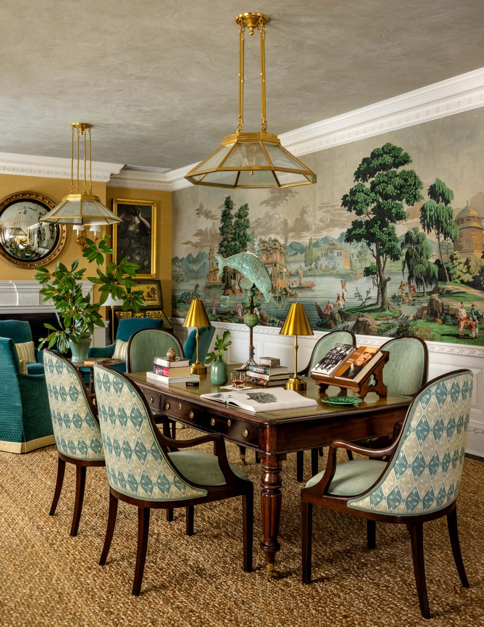 Dining area featuring a wooden table and upholstered chairs.