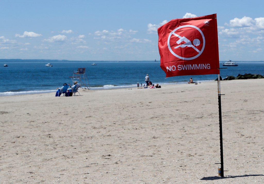 "No swimming" flag on Coney Island beach.