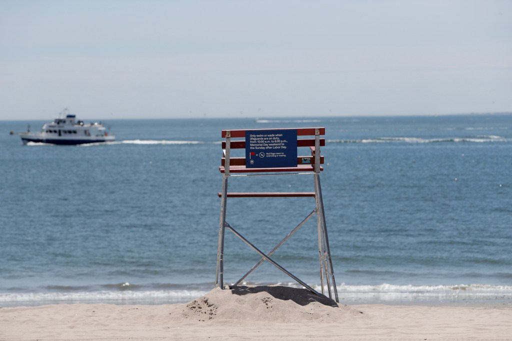 Empty lifeguard chair on Coney Island beach.