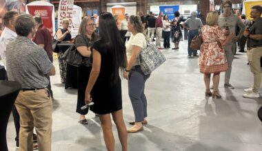 Friends and supporters of Hunger Fight attend their open house.