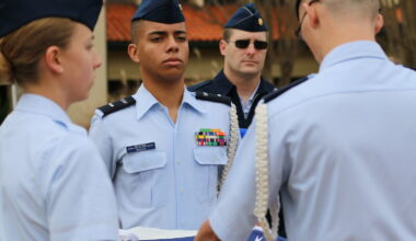 Civil Air Patrol cadets with the Deer Valley Composite Squadron 302 perform a ceremonial flag folding.