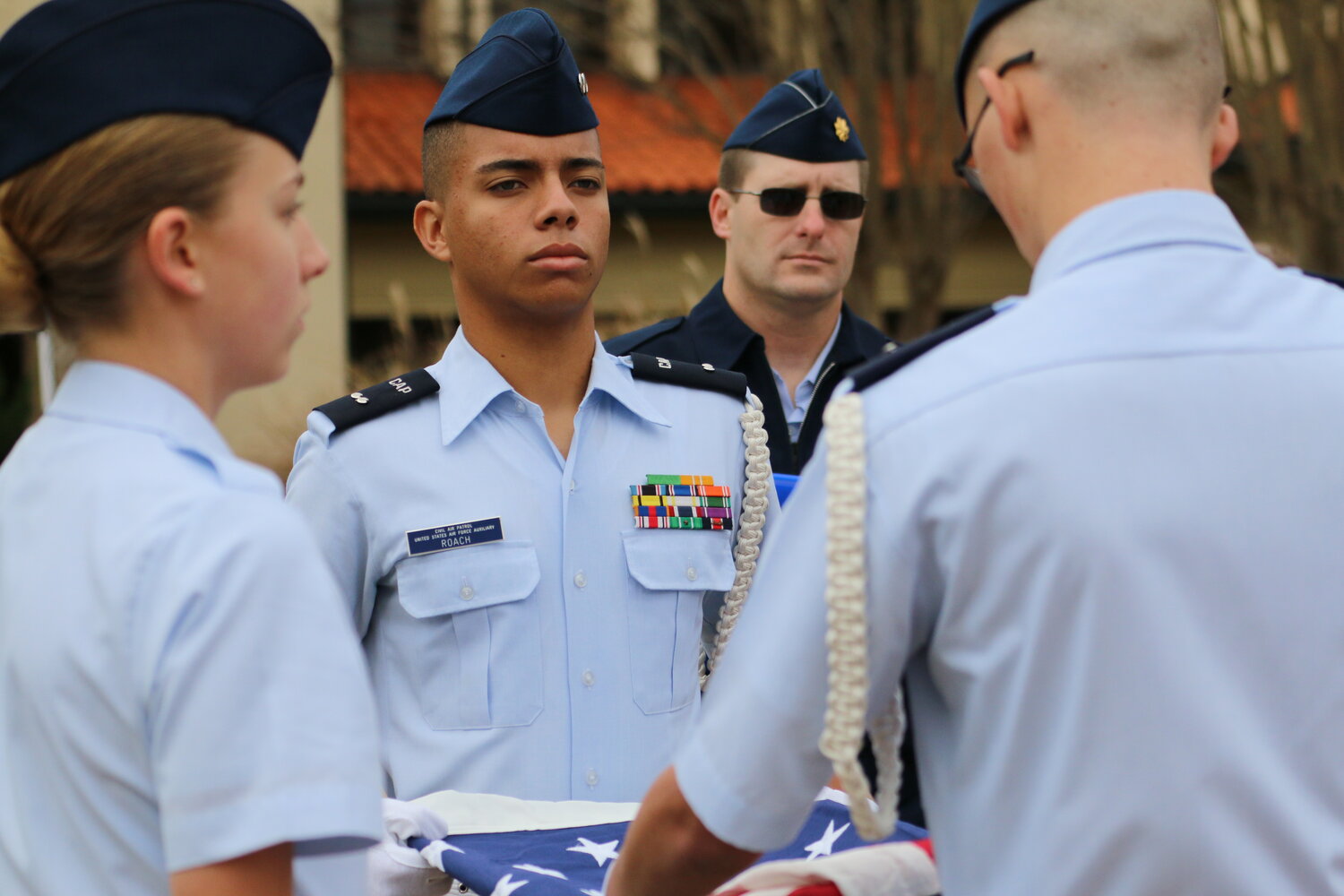 Civil Air Patrol cadets with the Deer Valley Composite Squadron 302 perform a ceremonial flag folding.