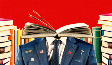 This illustration shows a person in a suit, but their head is an open book. The suit has various political and religious pins, like a U.S. flag, a cross, a GOP elephant, and “In God We Trust.” The background is bright red, with stacks of books on both