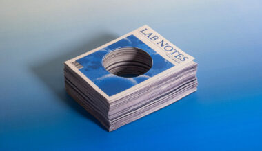 A stack of science journals with a big hole cut through the middle of them