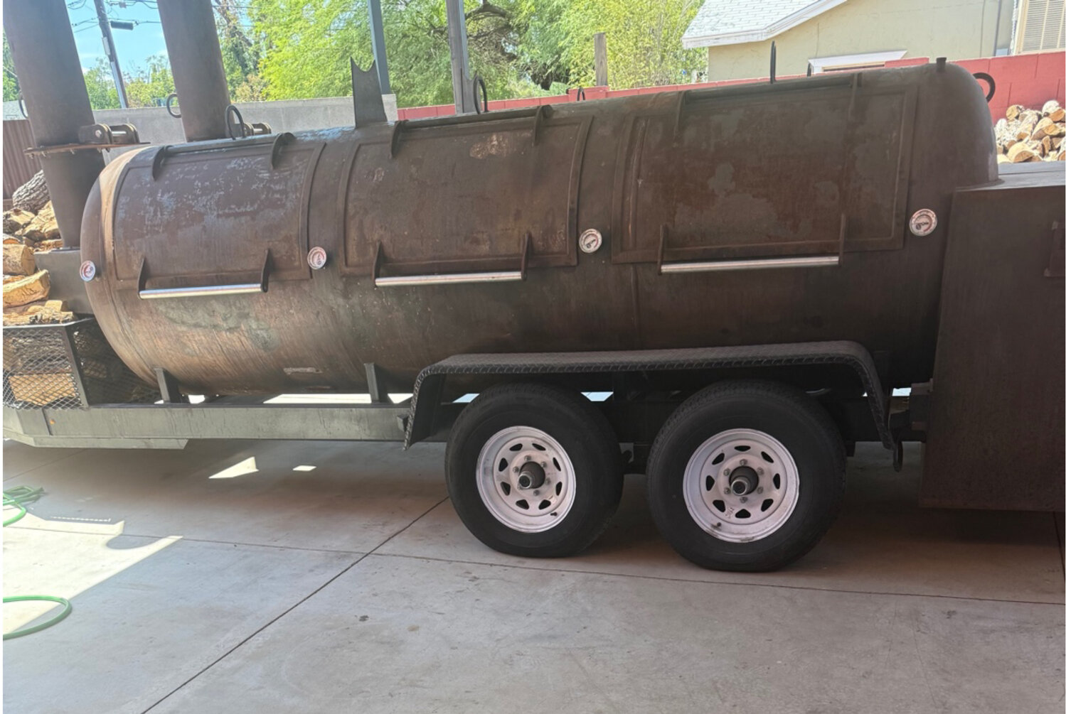On July 9, the applicant was issued a correction notice for smoke emissions and operating an outdoor smoker without a use permit.