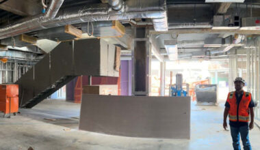 A construction worker looks at the ceiling of the garden level (first floor) of the still under construction Glendale City Hall. The mayor