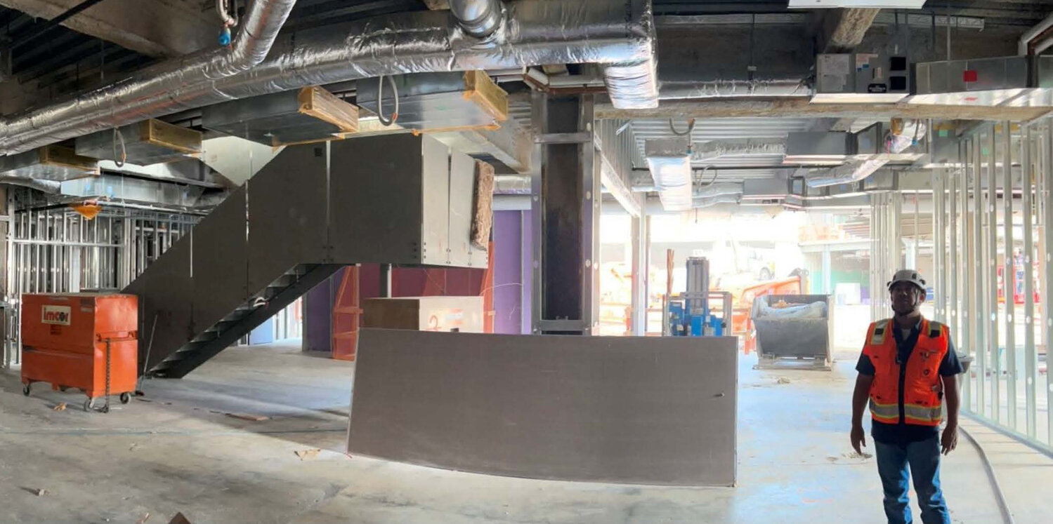 A construction worker looks at the ceiling of the garden level (first floor) of the still under construction Glendale City Hall. The mayor