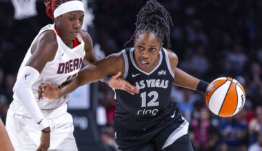 Aces guard Chelsea Gray (12) drives the lane as she battles with Atlanta Dream guard Rhyne Howa ...