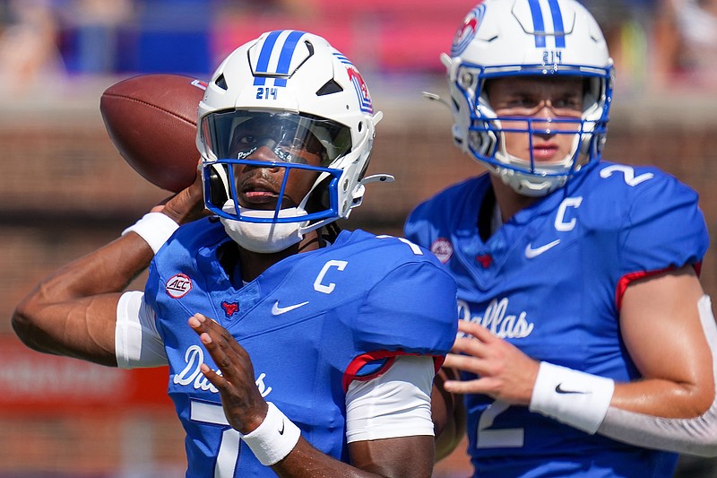 SMU quarterbacks Kevin Jennings (7) and Preston Stone (2)  warm up before an NCAA football game against TCU at Ford Stadium on Saturday, Sept. 21, 2024, in Dallas. (Smiley N. Pool/The Dallas Morning News/TNS)